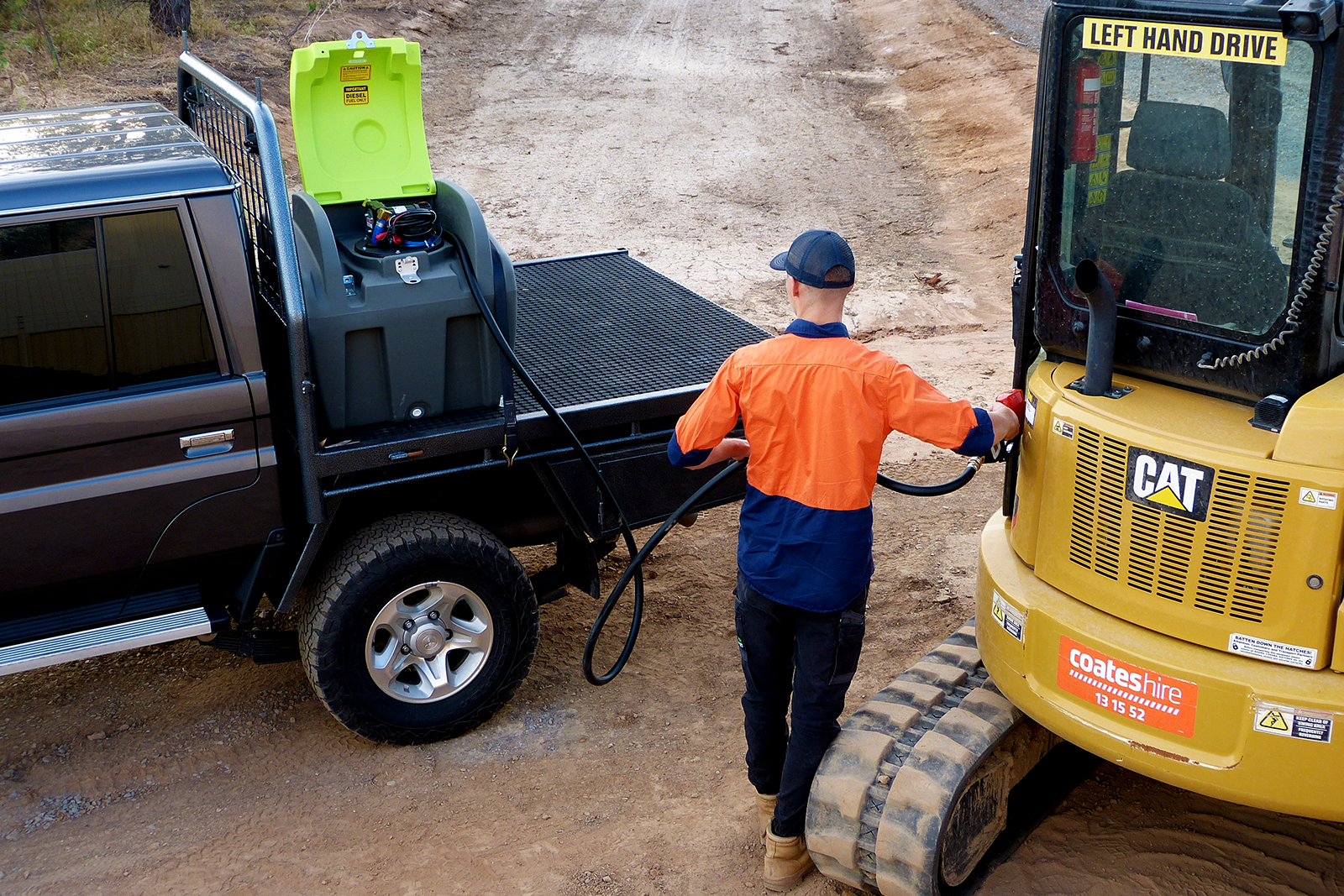 Portable Diesel Fuel Tank Pod refilling a heavy machinery