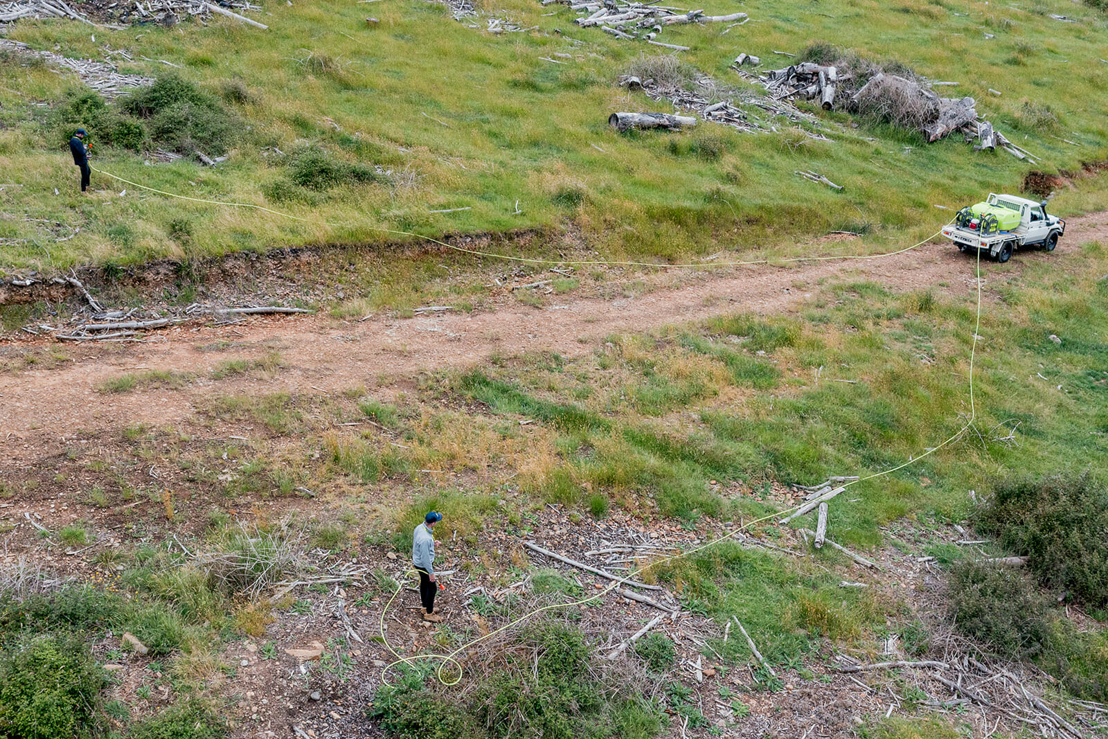 Man is using SuperReel Twin Reel Spray Unit